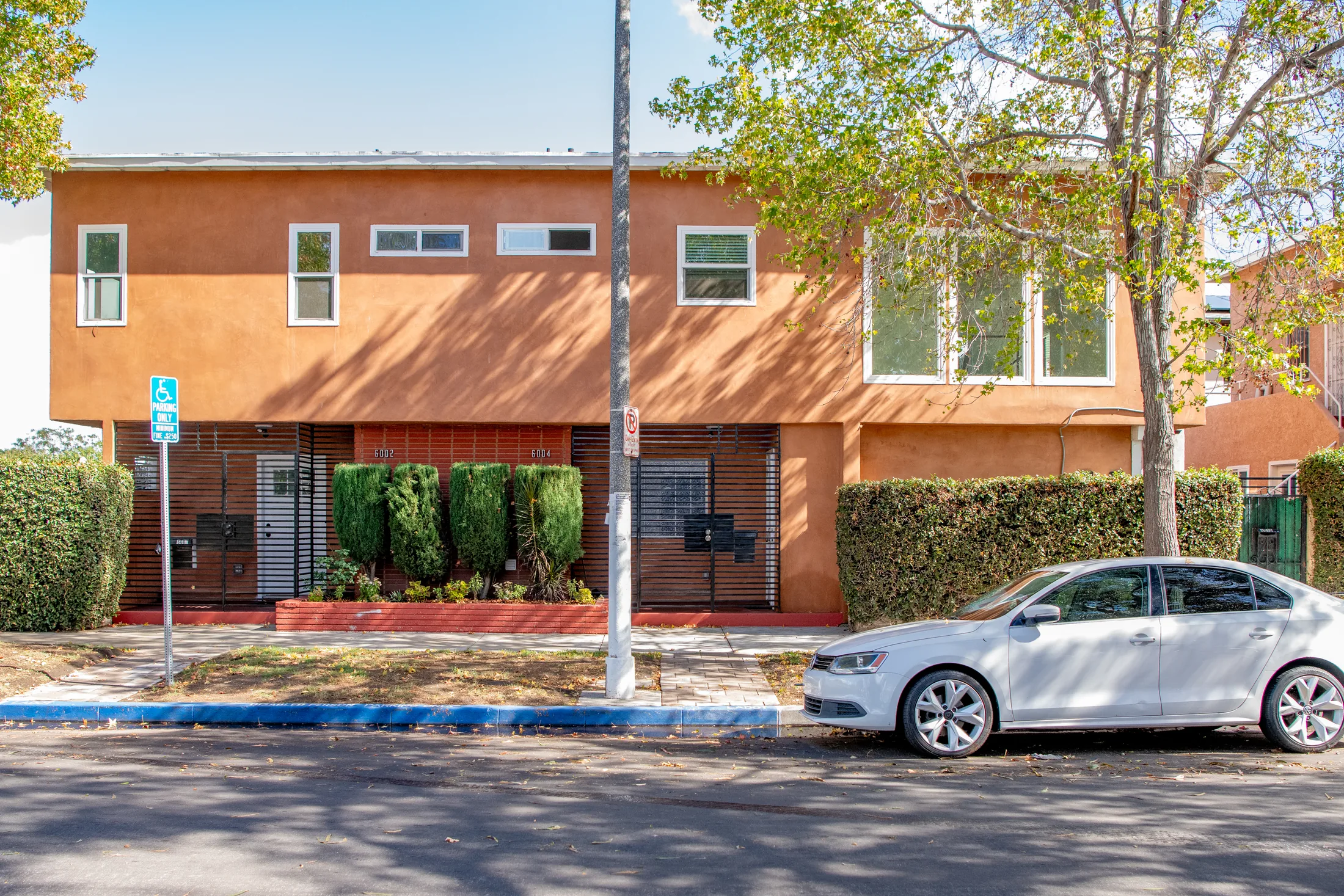 Exterior of the two-story duplex at 6002-6004 S Denker