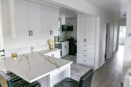 Living area with a light sofa and dining table